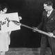 1925: Clara Bow holds up a large card while Larry Gray inscribes a New Year’s greeting with a giant pen. (Photo: General Photographic Agency/Getty Images)